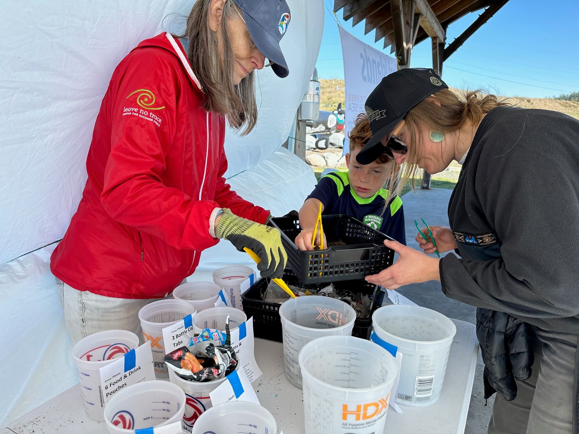 Volunteers sort micro plastics found at Jackson Beach